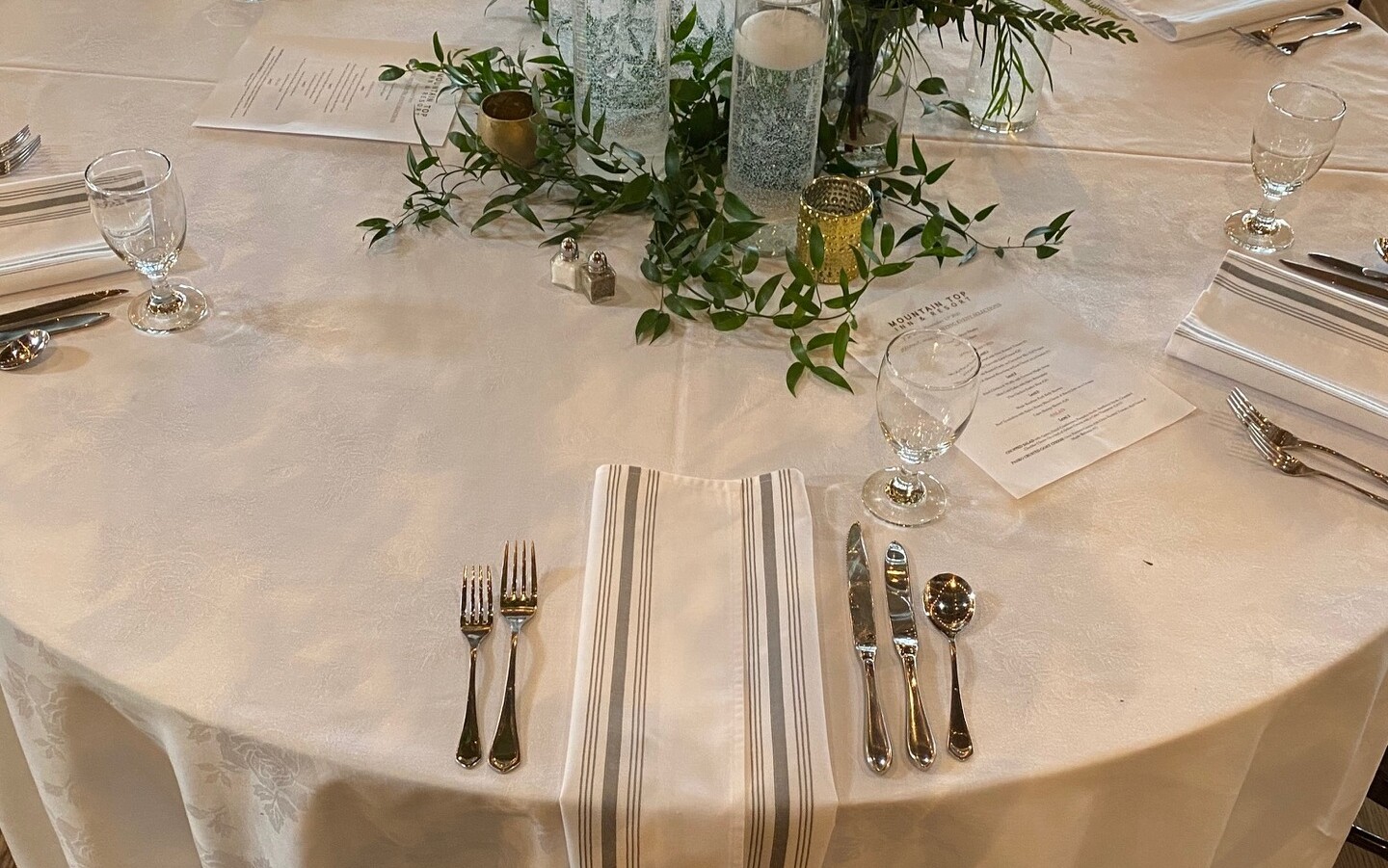 Grey Bistro Stripe Napkin on white tablecloth