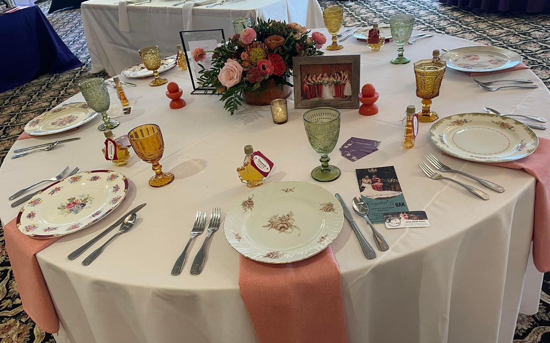 mismatched antique plates with salmon napkin